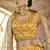 mustard Swarovski and gota embroidered silk stitched printed lehenga
