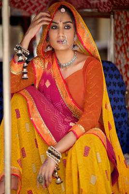 Yellow printed pure georgette saree with blouse 2