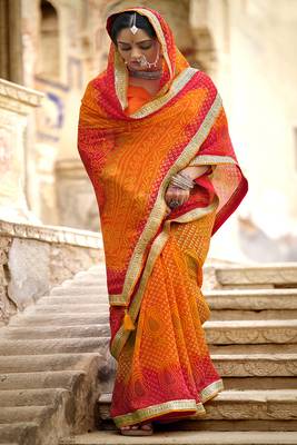 Orange printed pure georgette saree with blouse 1