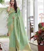 Light green woven banarasi silk saree with blouse