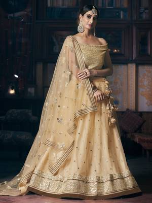 Beige embroidered net semi stitched lehenga 1