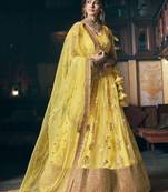 Yellow embroidered net semi stitched lehenga