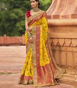 Yellow embroidered silk saree with blouse