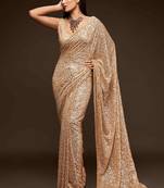 Beige embroidered georgette saree with blouse