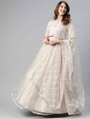 Beige embroidered net semi stitched lehenga 1