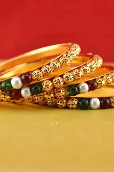 Rajasthani gokharoo,kara churi meenakari,moti,cz,stone,bangles 