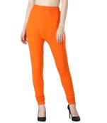 Women Orange Solid Churidar Leggings