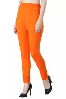Women Orange Solid Churidar Leggings