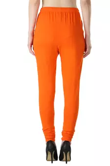 Women Orange Solid Churidar Leggings