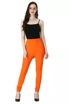 Women Orange Solid Churidar Leggings