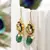 Green pearl earrings