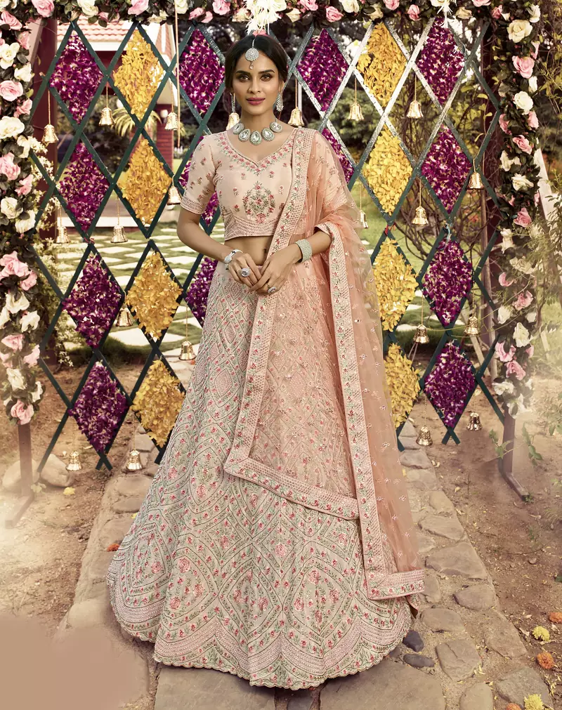 Fetching Almond Peach swarovski, zarkan, zari, and resham embroidered crepe semi stitched wedding lehenga