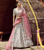 glamourous Green sequins, swarovski, zarkan, and resham embroidered satin semi stitched wedding lehenga