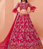 Pink embroidered net semi stitched lehenga