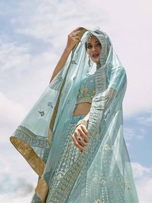 Turquoise embroidered organza semi stitched lehenga 1