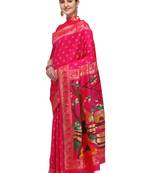 Pink woven banarasi silk saree with blouse