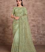 Dark green embroidered net saree with blouse