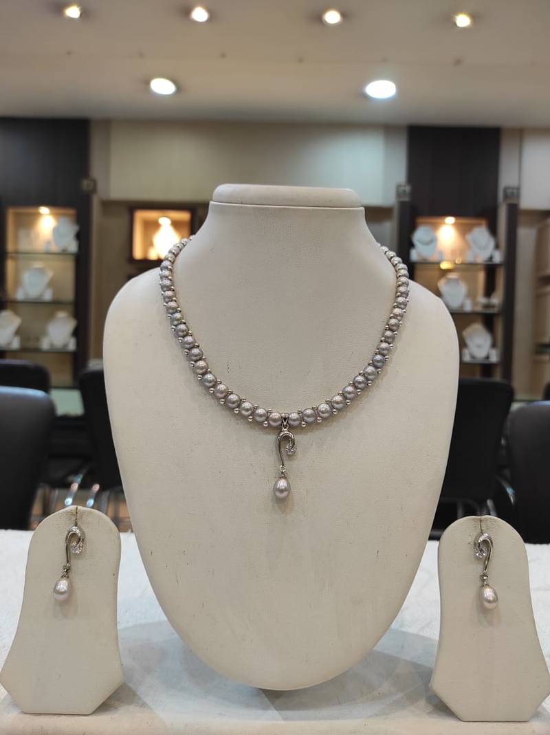 Grey pearl necklaces