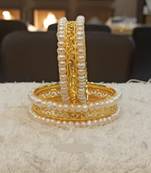 White pearl bangles-and-bracelets