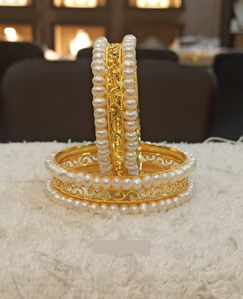 White pearl bangles-and-bracelets
