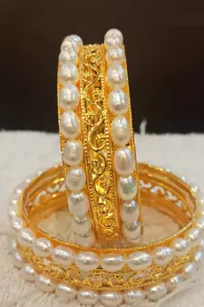 White pearl bangles-and-bracelets