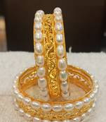 White pearl bangles-and-bracelets