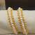 White pearl bangles-and-bracelets