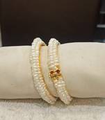 White pearl bangles-and-bracelets