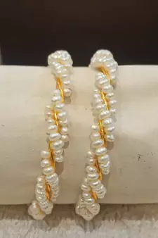 White pearl bangles-and-bracelets