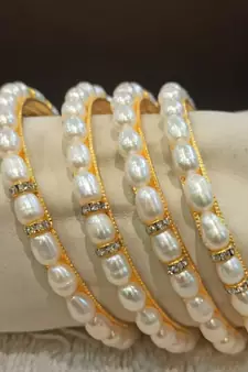White pearl bangles-and-bracelets