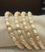 White pearl bangles-and-bracelets