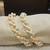 White pearl bangles-and-bracelets