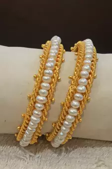 White pearl bangles-and-bracelets