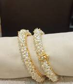 White pearl bangles-and-bracelets