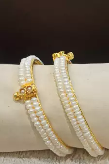 White pearl bangles-and-bracelets