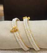 White pearl bangles-and-bracelets
