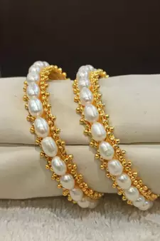 White pearl bangles-and-bracelets