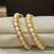 White pearl bangles-and-bracelets