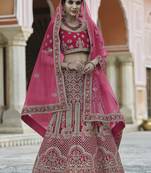 Bewitching Pink hand work and heavy embroidered velvet Semi Stitched wedding Lehenga
