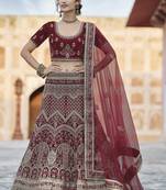 Bewitching Maroon hand work and heavy embroidered velvet Semi Stitched Bridal Lehenga