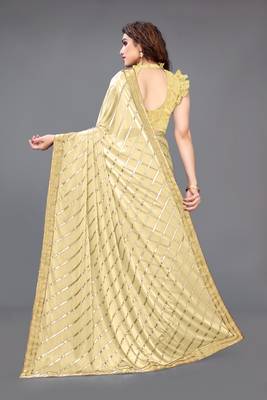 Beige embroidered lycra saree with blouse 5