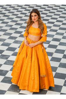 Yellow printed brocade stitched lehenga