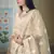 Dutch Cream thread embroidered with foil mirror worked organza semi stitched lehenga