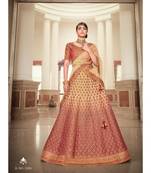 Nakkashi Rust colour shaded lurex handloom silk lehenga having beige colour net dupatta