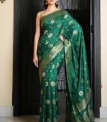 Dark green woven silk saree with blouse