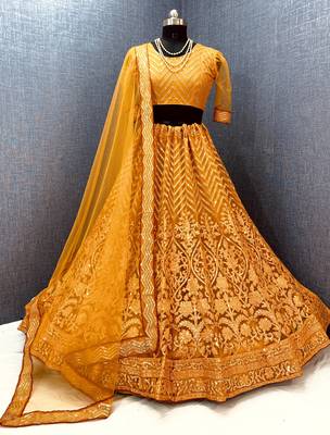 Gold embroidered net semi stitched lehenga 2