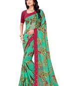 Turquoise printed brasso saree with blouse