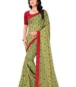 Light green printed brasso saree with blouse