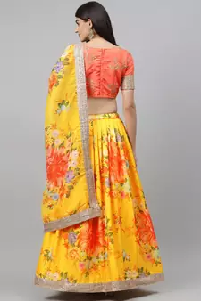 Engrossing Yellow Floral Designer Lehenga with rich embroidered Peach Blouse and Dupatta