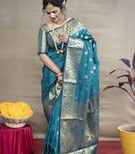 Teal woven paithani silk blend saree with blouse
